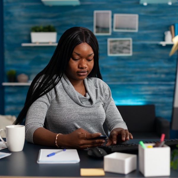 Employee looking at credit card and thinking about buying clothes